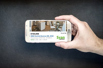 Phone with Syan Real Estate alert